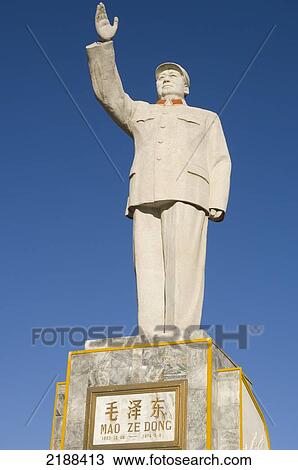 Stock Image - China. Moa Square In The New City Down Town. Typical Statue Of Chairman Mao Zedung As Can Be Found With Minor Variations And Size In So Many Chinese Towns And Cities. Fotosearch