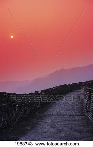 Stock Image - China, Mu Tian Yu, The Great Wall Of China, Bright Red Sky And Distant Moon. Fotosearch