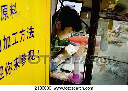 Stock Photograph - China, Sichuan, Chengdu, Craftsman at work; Wenshu Yuan. Fotosearch