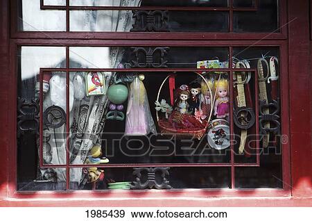 Stock Photo - China, Tianjin, Culture Street, Trinkets Hanging In Store Window.. Fotosearch