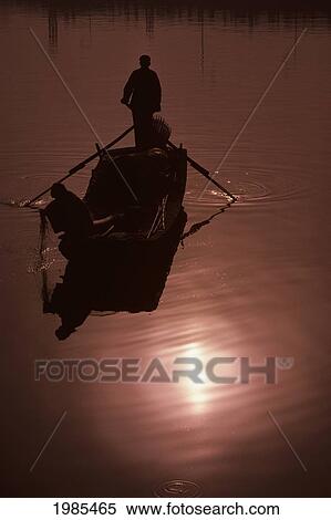 China, Tianjin, Hai River, Silhouetted Fishermen On Smooth Water At Sunset. View Large Photo Image Stock Photography - China, Tianjin, Hai River, Silhouetted Fishermen On Smooth Water At Sunset.. Fotosearch