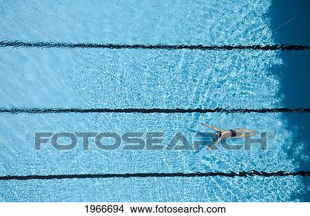 Picture - China, View From Above; Guangzhou, Woman Swimming In Pool. Fotosearch