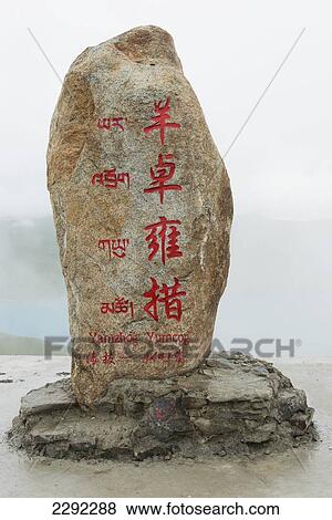 Stock Photo - China, Xizang, Rock with red Chinese characters. Fotosearch