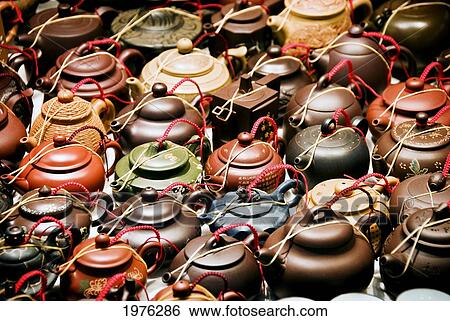 Stock Photograph - China, Yau Ma Tei K; Hong Kong, Ceramic Teapots On Display At Jade Market On Kansu And Battery Streets. Fotosearch