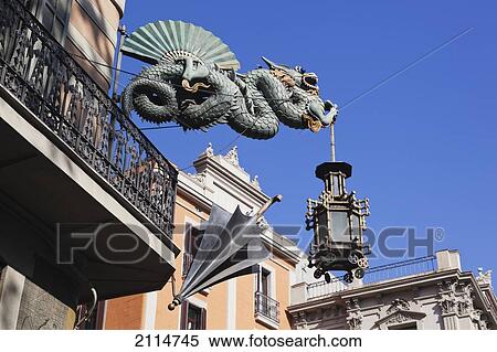 Stock Photography - Chinese Dragon And Umbrella At Casa Dels Paraigues On The Ramblas; Barcelona Spain. Fotosearch