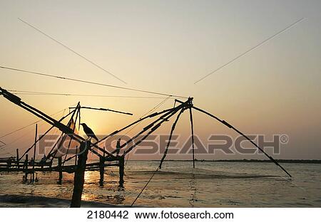 Stock Image - Chinese fishing nets; Fort Kochi, Kerala, India. Fotosearch