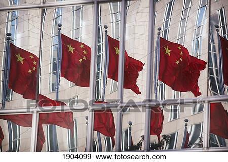 Stock Photo - Chinese Flags Reflected In Office Skyscraper Windows, Beijing, China. Fotosearch