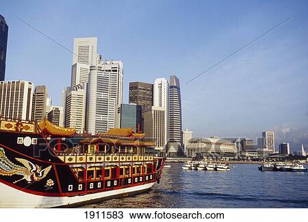 Chinese Junk And Skyine At Dawn, Singapore. View Large Photo Image Stock Image - Chinese Junk And Skyine At Dawn, Singapore.. Fotosearch