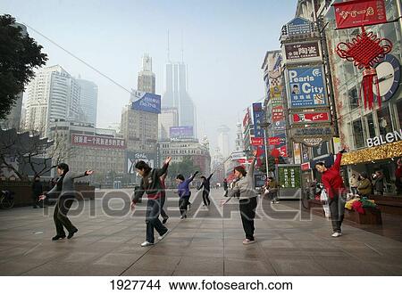 Chinese Women Doing Dance And Tai Chi Exercises In A Shopping Precinct, Shanghai, China View Large Photo Image Picture - Chinese Women Doing Dance And Tai Chi Exercises In A Shopping Precinct, Shanghai, China. Fotosearch