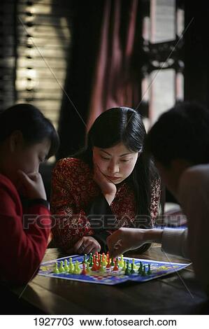 Stock Image - Chinese Women Playing The Board Game Chinese Checkers In Pingyao, A Unesco World Heritage Site, Shanxi Province, China. Fotosearch