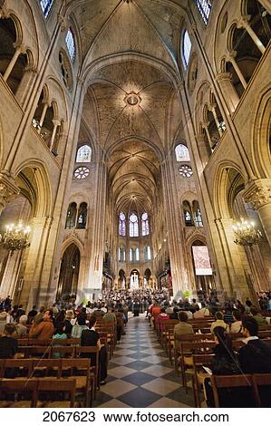 Choir Performing During A Mass In Notre Dame De Paris Cathedral, Paris, France View Large Photo Image Stock Image - Choir Performing During A Mass In Notre Dame De Paris Cathedral, Paris, France. Fotosearch