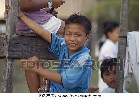 Stock Image - Chrildren Play Beside Their Home ÃƒÆ’Ã‚Â¡. Fotosearch