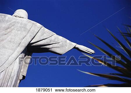 Stock Image - Christ The Redeemer And Palm Leaves. Fotosearch