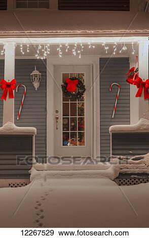Stock Photo - Christmas decorations and lights on the front of a house; Waterloo, Quebec, Canada. Fotosearch