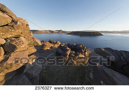Chullpa (ancient Colla funerary tower) overlooking Lake Umayo, Sillustani, Puno, Peru View Large Photo Image Stock Photo - Chullpa (ancient Colla funerary tower) overlooking Lake Umayo, Sillustani, Puno, Peru. Fotosearch