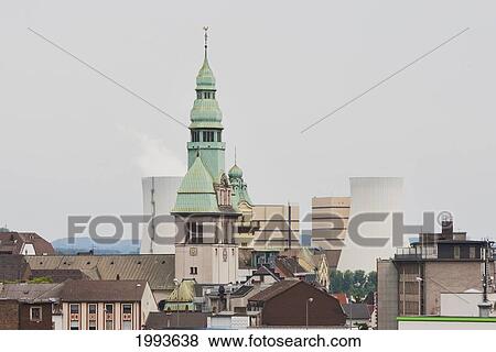 Stock Photo - Church and power plant, Volklingen, Germany. Fotosearch