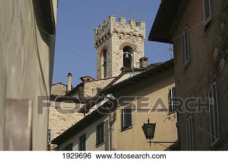 Church bell tower from main street in the centre of 'Radda in Chianti', a beautiful small town and a famous region known for its chianti wine, in Tuscany. Italy. June. View Large Photo Image Stock Photograph - Church bell tower from main street in the centre of 'Radda in Chianti', a beautiful small town and a famous region known for its chianti wine, in Tuscany. Italy. June.. Fotosearch