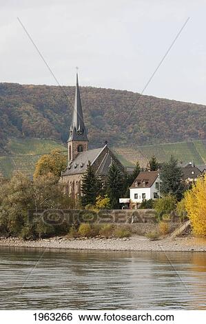 Stock Photograph - Church In Filsen, As Seen From The Rhine River, Rhineland-Palatinate, Germany. Fotosearch