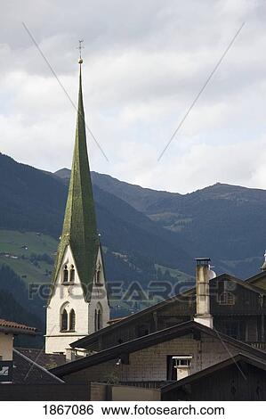 Stock Photograph - Church Steeple And Hill Side, Zell Am Zeller, Tirol, Austria. Fotosearch