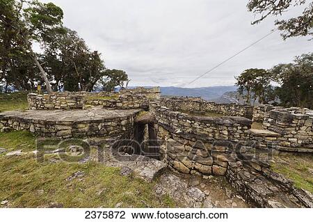 Stock Image - Circular buildings and funnel-shaped defensive entrance to Kuelap Fortress, Kuelap, Amazonas, Peru. Fotosearch