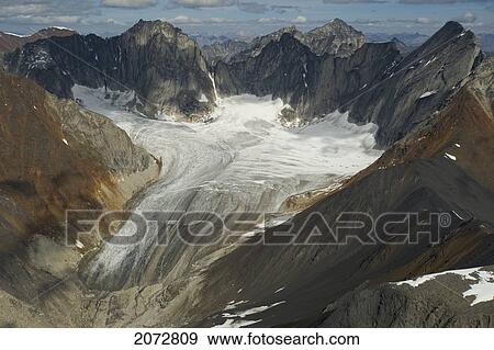 Stock Photo - Cirque Of Unclimbables, A Circle Of Granite Walls Which Draws Rock Climbers From All Over The World. Britnell Glacier In Background, Nahanni National Park, Northwest Territories. Fotosearch
