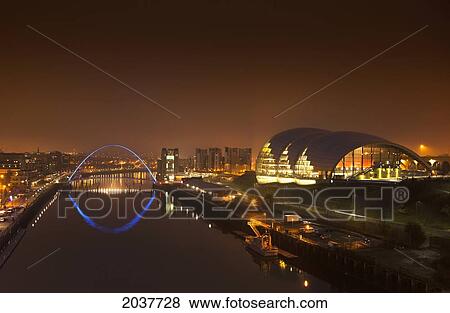 Stock Photo - City And River Tyne Illuminated At Night; Newcastle Northumberland England. Fotosearch