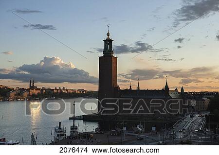 City Hall Along The Water's Edge At Sunset; Stockholm Sweden View Large Photo Image Picture - City Hall Along The Water's Edge At Sunset; Stockholm Sweden. Fotosearch