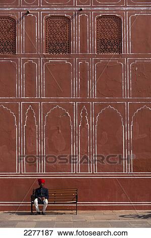 Stock Photo - City Palace guard sitting on bench, Jaipur, Rajasthan, India.. Fotosearch