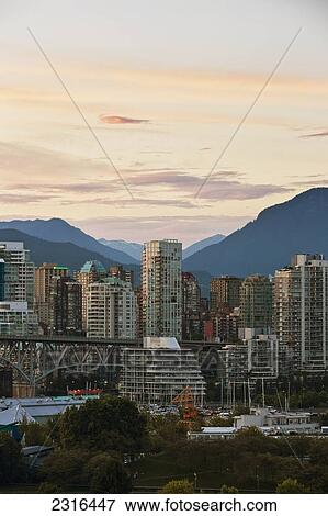 City Skyline At Sunset; Vancouver British Columbia Canada View Large Photo Image Stock Photo - City Skyline At Sunset; Vancouver British Columbia Canada. Fotosearch