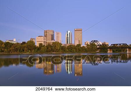 City Skyline From St. Boniface With The Cn Mainline Railbridge And Red River In The Foreground, Winnipeg, Manitoba View Large Photo Image Picture - City Skyline From St. Boniface With The Cn Mainline Railbridge And Red River In The Foreground, Winnipeg, Manitoba. Fotosearch