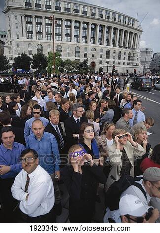 Stock Photography - City Workers Looking At Solar Eclipse. Fotosearch