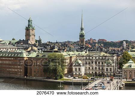 Stock Image - Cityscape And Road Going Across Water; Stockholm Sweden. Fotosearch