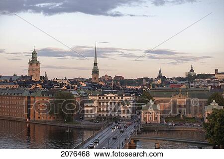 Cityscape At Sunset With Road Going Over Water; Stockholm Sweden View Large Photo Image Stock Photo - Cityscape At Sunset With Road Going Over Water; Stockholm Sweden. Fotosearch
