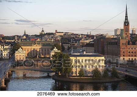 Cityscape At Sunset With Road Going Over Water; Stockholm Sweden View Large Photo Image Stock Photo - Cityscape At Sunset With Road Going Over Water; Stockholm Sweden. Fotosearch