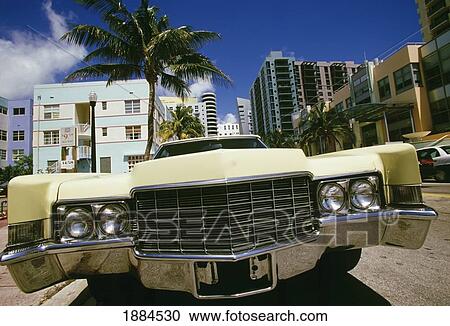 Stock Image - Classic Car And Buildings, Close Up. Fotosearch