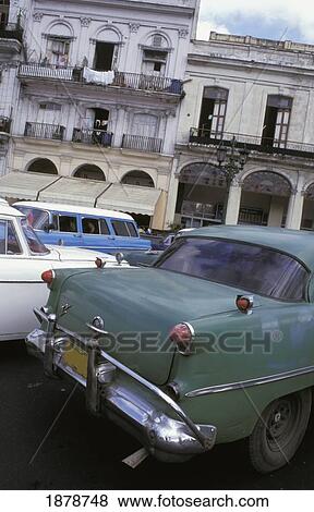 Stock Photo - Classic Cars On A Street In Havana. Fotosearch
