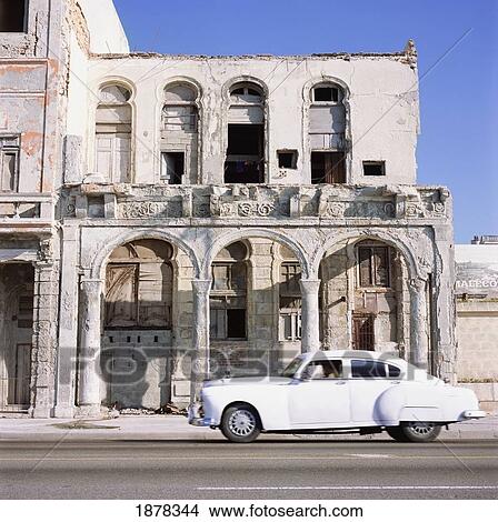 Classic White Car Passing Rundown Building View Large Photo Image Picture - Classic White Car Passing Rundown Building. Fotosearch
