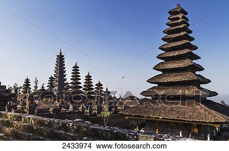 Picture - Classical tiered thatched-roofs merus (towers) in the Mother Temple of Besakih, Bali, Indonesia. Fotosearch