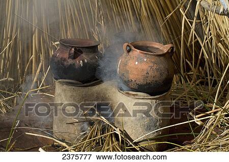 Stock Photo - Clay stove on Chisawa, a reed island made by the Urus Iruitos people in Titicaca Lake, Bolivia. Fotosearch