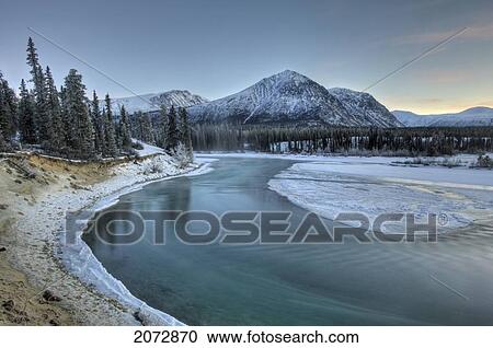 Clear, Clean Waters Of Takhini River In Late Fall With Mount Vanier In Background, Kusawa Lake Territorial Park, Yukon Territory, Canada View Large Photo Image Stock Image - Clear, Clean Waters Of Takhini River In Late Fall With Mount Vanier In Background, Kusawa Lake Territorial Park, Yukon Territory, Canada. Fotosearch