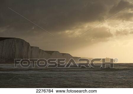 Cliffs of the Seven Sisters Country Park at dawn on stormy day; East Sussex, England View Large Photo Image Picture - Cliffs of the Seven Sisters Country Park at dawn on stormy day; East Sussex, England. Fotosearch