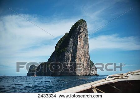 Cliffs rise from the ocean on one of the islands surrounding Koh Phi Phi Island in the Andaman Sea; Thailand View Large Photo Image Picture - Cliffs rise from the ocean on one of the islands surrounding Koh Phi Phi Island in the Andaman Sea; Thailand. Fotosearch