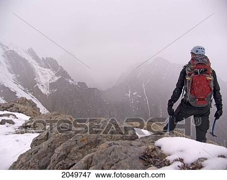 Stock Photo - Climber On Top Of Mount Kody In Jasper National Park, Alberta. Fotosearch