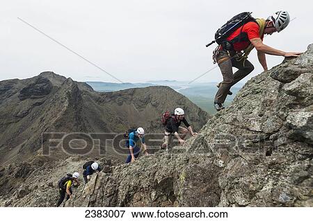 Climbers ascending ridge of Am Basteir in the Black Cuillin; Isle of Skye, Scotland View Large Photo Image Stock Photo - Climbers ascending ridge of Am Basteir in the Black Cuillin; Isle of Skye, Scotland. Fotosearch