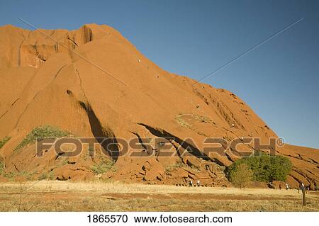 Stock Image - Climbers On Ayers Rock, Northern Territories, Australia. Fotosearch