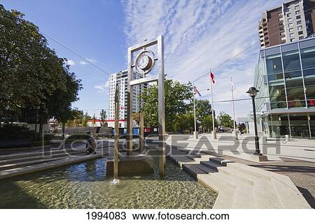 Clock In An Ornamental Pool At The Civic Plaza, North Vancouver, British Columbia, Canada View Large Photo Image Stock Image - Clock In An Ornamental Pool At The Civic Plaza, North Vancouver, British Columbia, Canada. Fotosearch