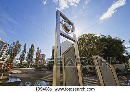 Stock Photography - Clock In An Ornamental Pool At The Civic Plaza, North Vancouver, British Columbia, Canada. Fotosearch
