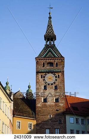 Clock tower topped with a weather van against a blue sky; Landsberg am Lech, Bavaria, Germany View Large Photo Image Stock Photo - Clock tower topped with a weather van against a blue sky; Landsberg am Lech, Bavaria, Germany. Fotosearch