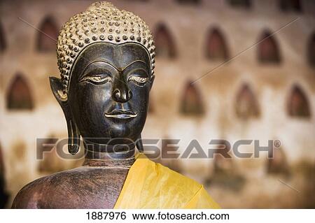 Stock Photograph - Cloister Containing Over 2000 Silver And Ceramic Buddhas In Small Niches.. Fotosearch