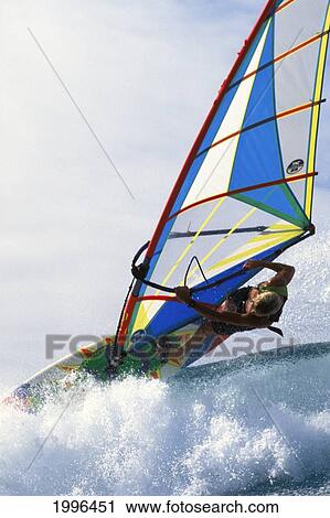 Close-Up Angle View Of Josh Angulo Over Tip Of Wave, Pale Blue Sky In Background View Large Photo Image Stock Image - Close-Up Angle View Of Josh Angulo Over Tip Of Wave, Pale Blue Sky In Background. Fotosearch